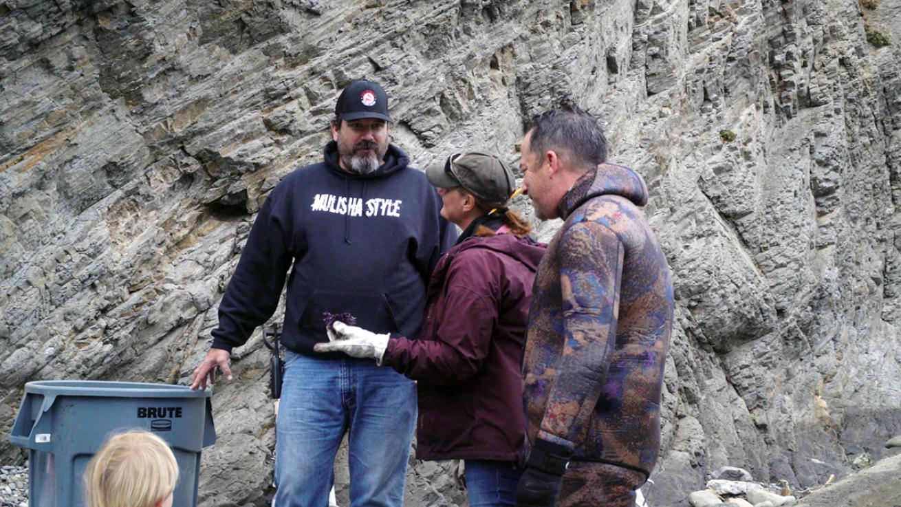 Joshua Russo and Dr. Cynthia Catton speak on beach